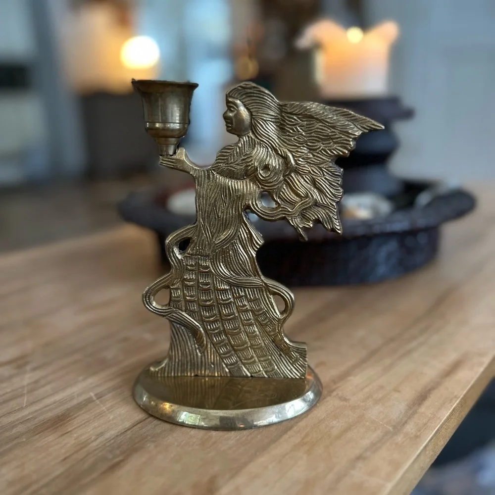 Elegant vintage brass Angel candle holder.  About 8”H Imperfection shown at base